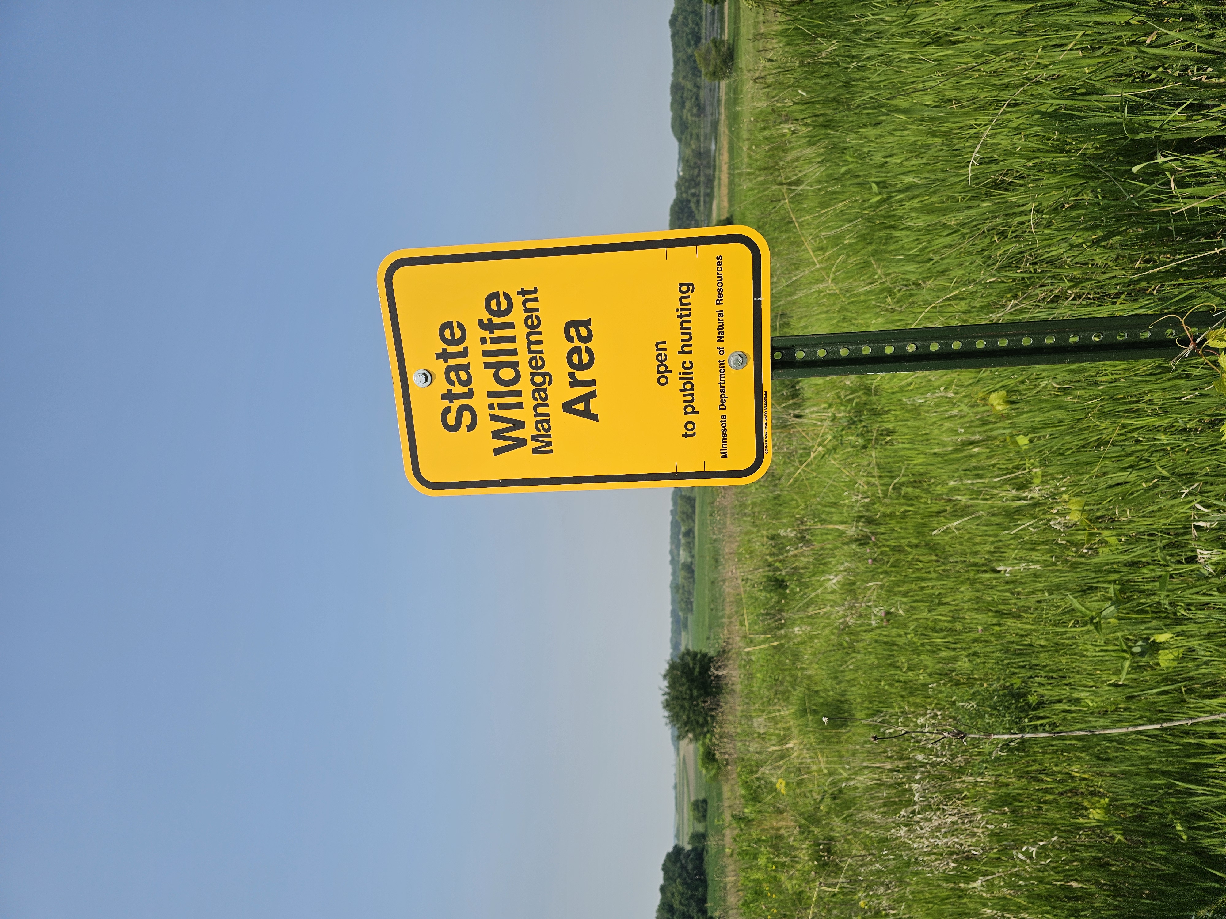 State Wildlife management area sign on grasslands at Horseshoe Lake WMA.